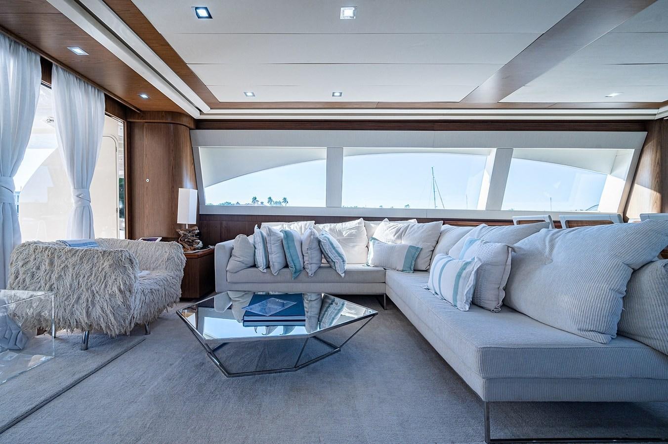 a room with a couch and a bed aboard FERRETTI Yacht for Sale