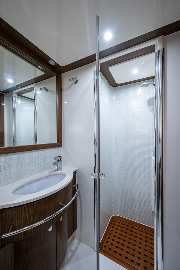 a bathroom with a shower unit and sink aboard FERRETTI Yacht for Sale