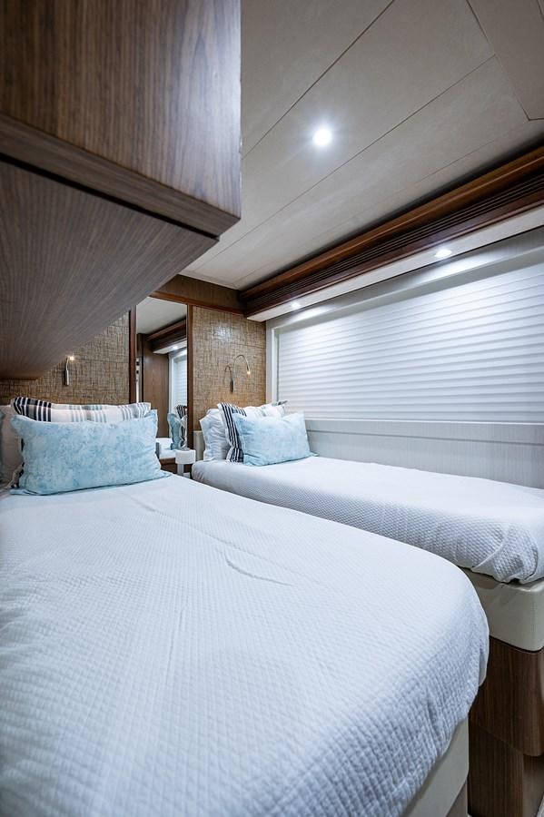 a bed with white sheets aboard FERRETTI Yacht for Sale