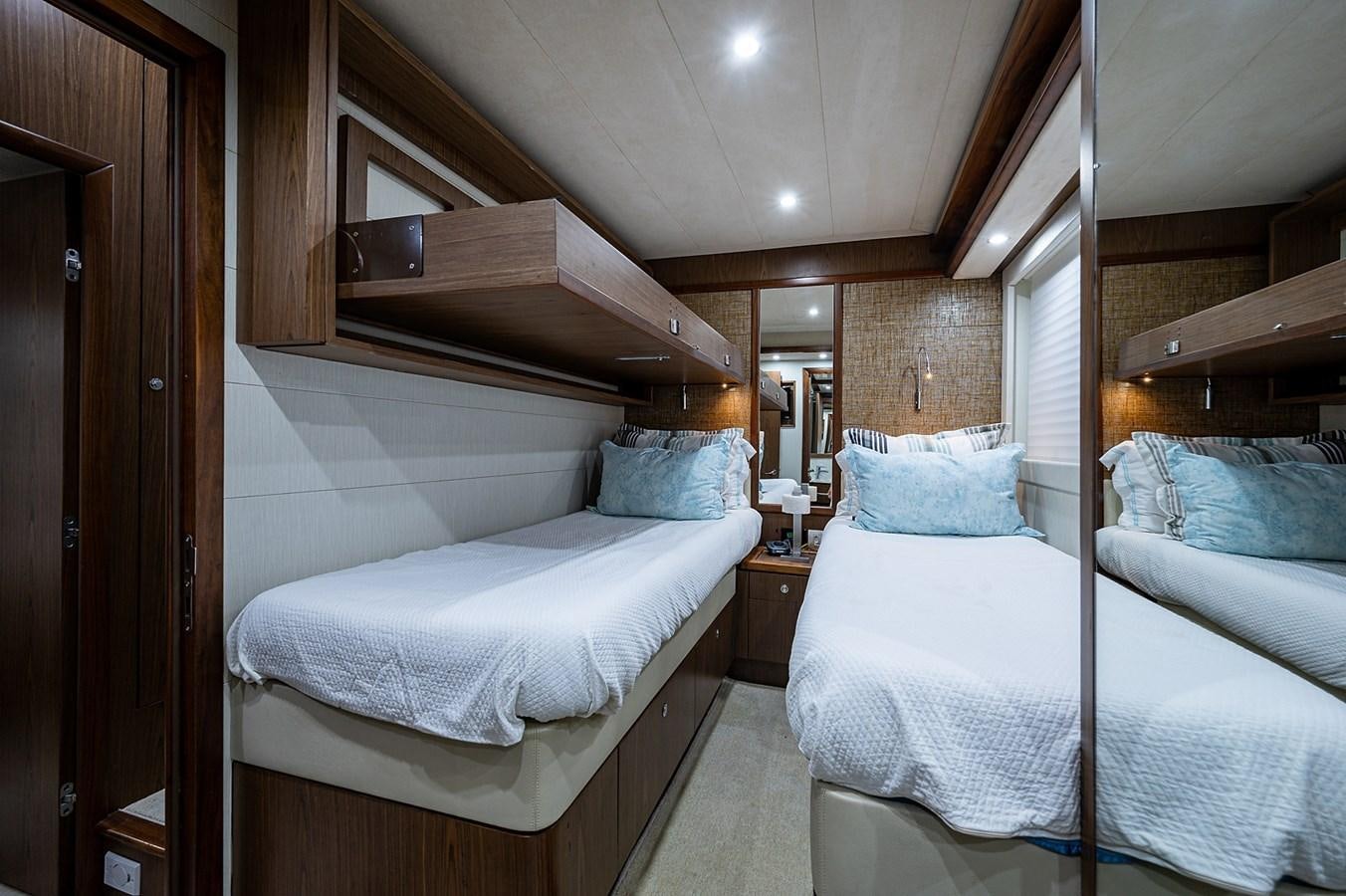 a room with two beds aboard FERRETTI Yacht for Sale