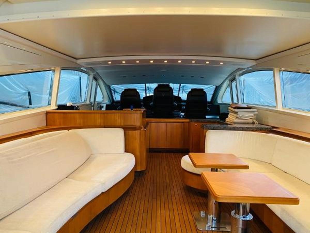 a bus with a bench and a table and chairs aboard 2008 ARNO LEOPARD Yacht for Sale