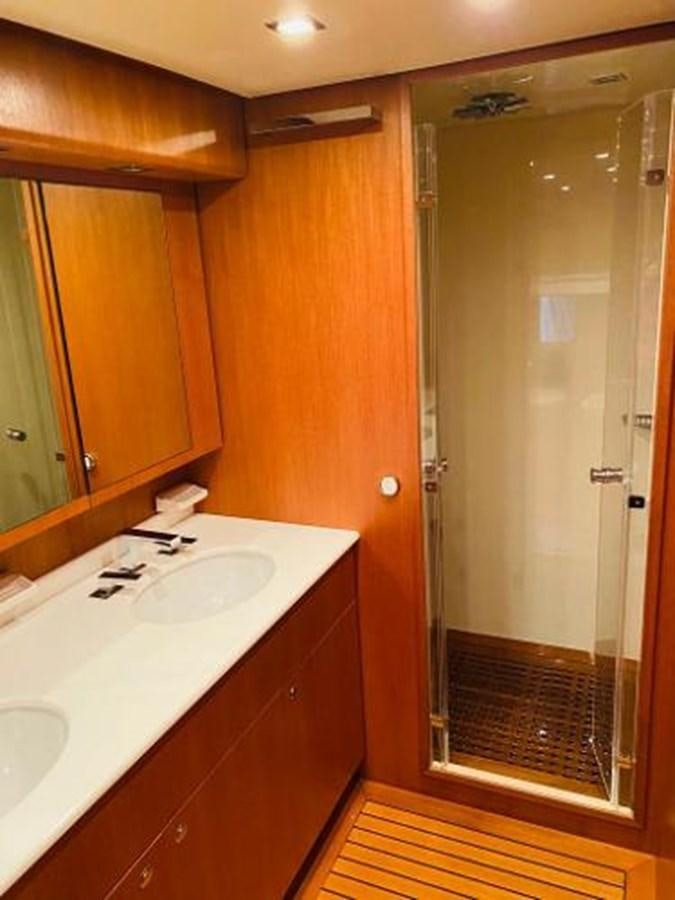 a bathroom with a sink and a mirror aboard 2008 ARNO LEOPARD Yacht for Sale