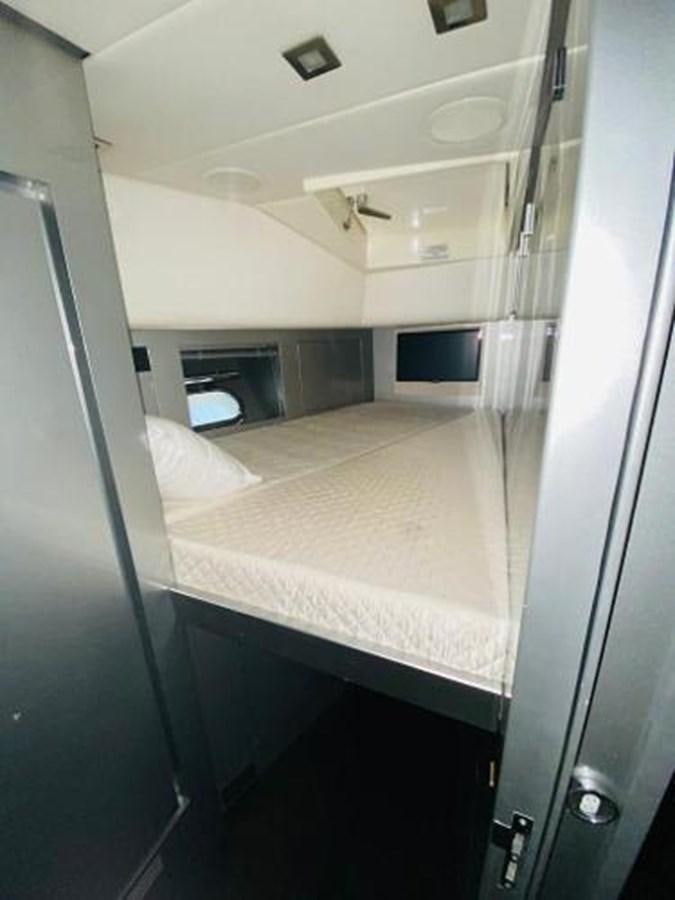 a small room with a bed aboard 2008 ARNO LEOPARD Yacht for Sale
