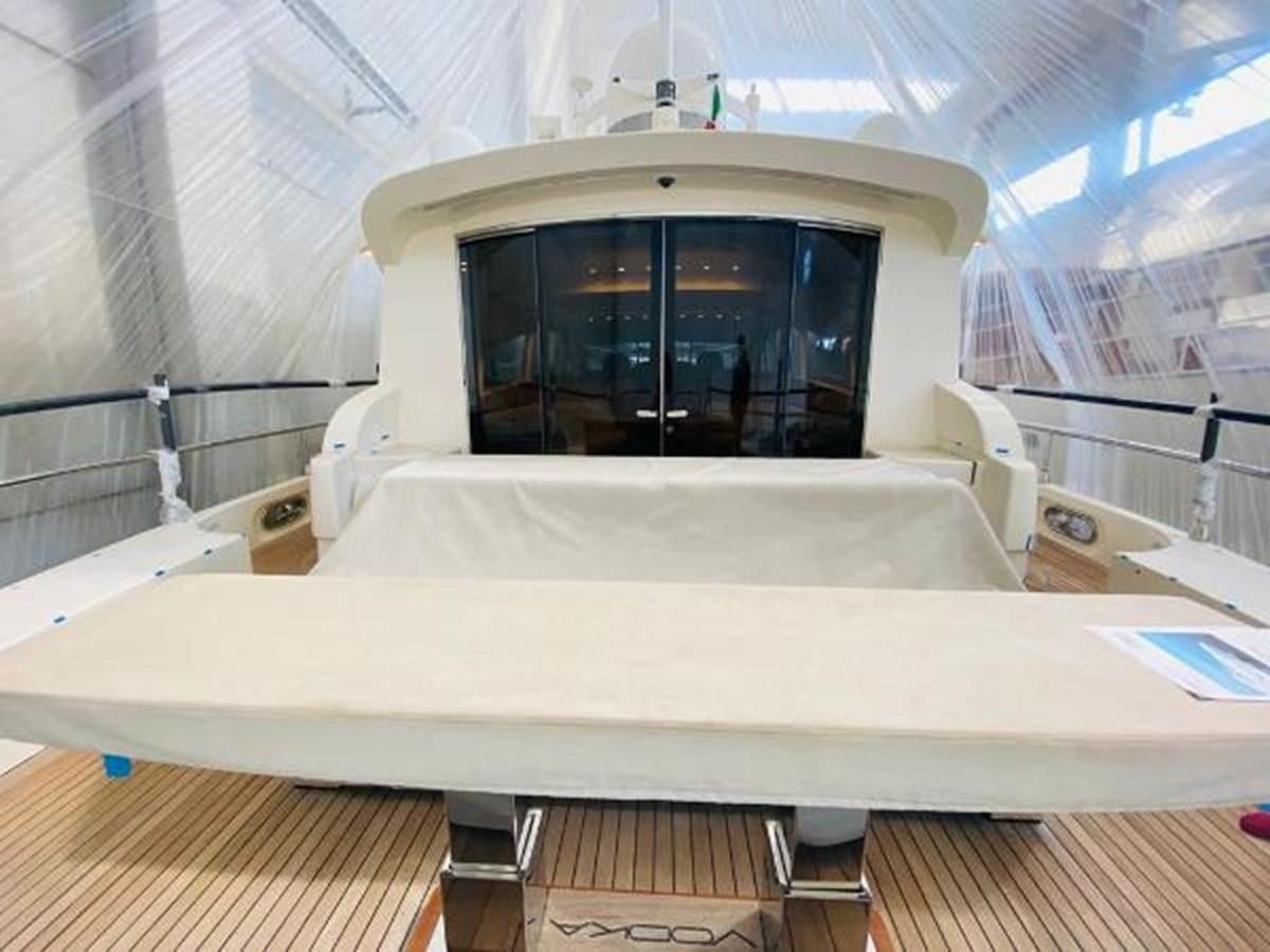 a large white bed with a white sheet and a window aboard 2008 ARNO LEOPARD Yacht for Sale