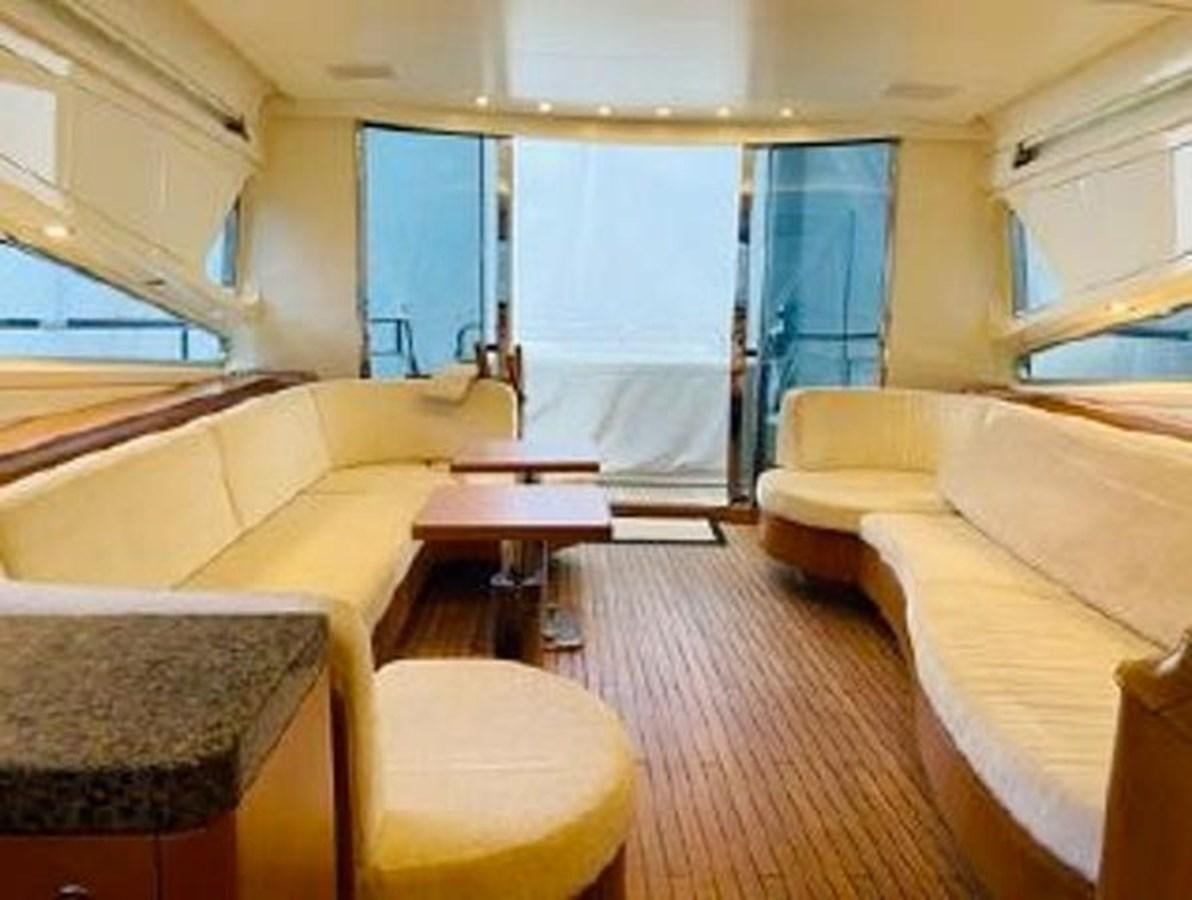 a room with a bed and a table aboard 2008 ARNO LEOPARD Yacht for Sale