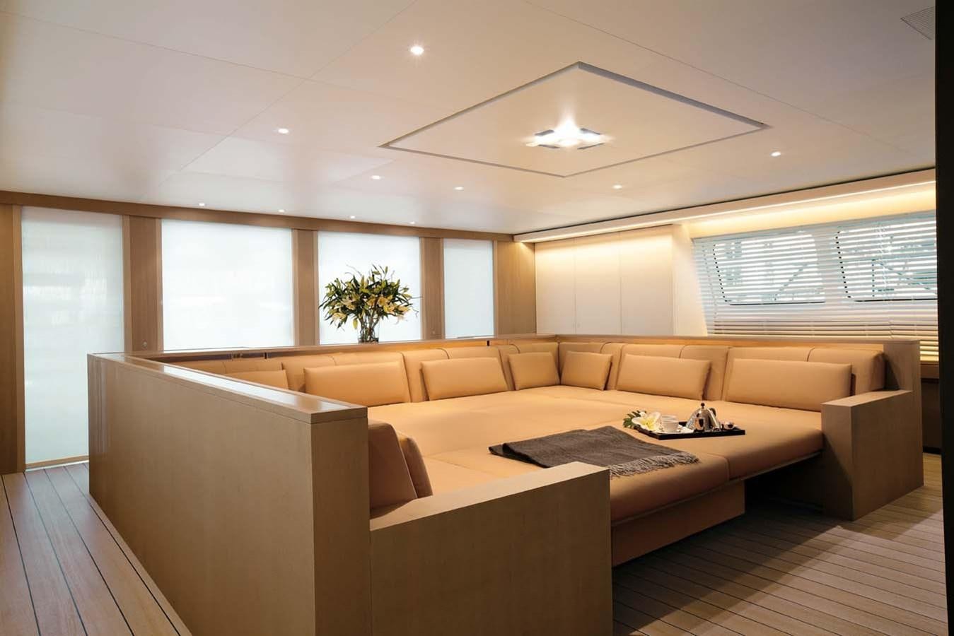 a room with a couch and a table aboard ENTERPRISE Yacht for Sale