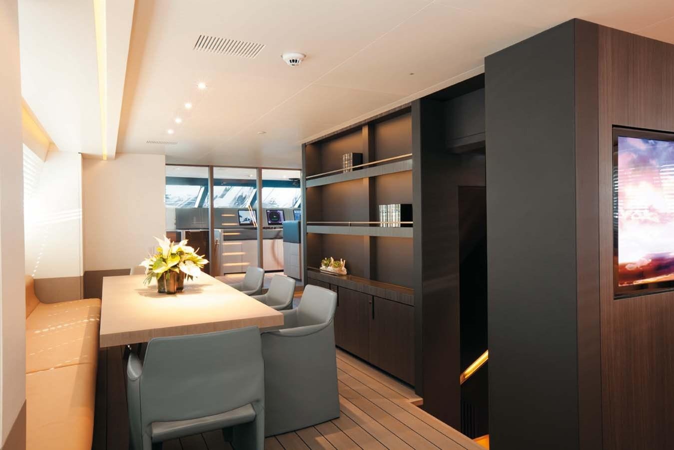 a room with a table and chairs aboard ENTERPRISE Yacht for Sale