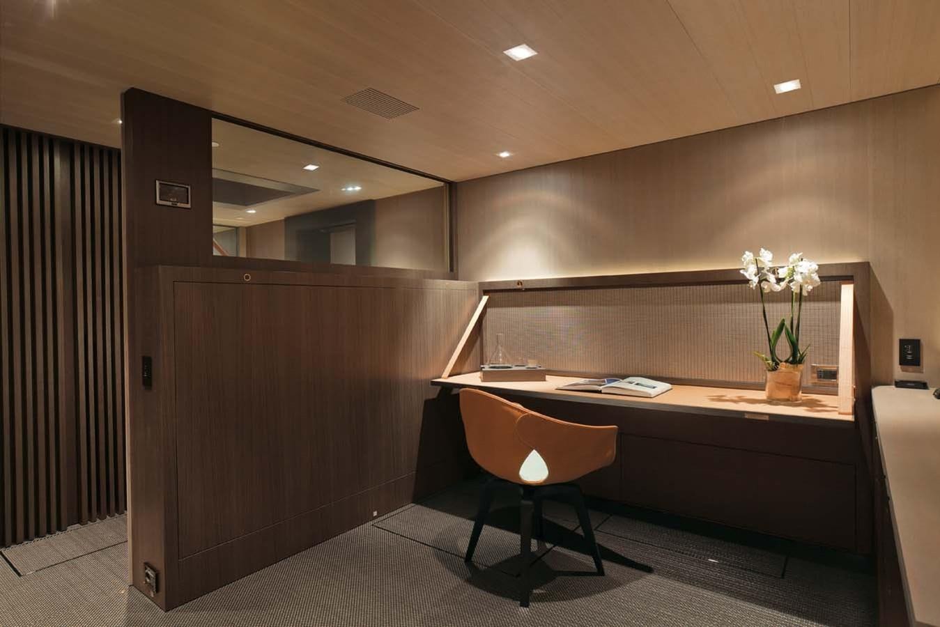 a room with a desk and chairs aboard ENTERPRISE Yacht for Sale