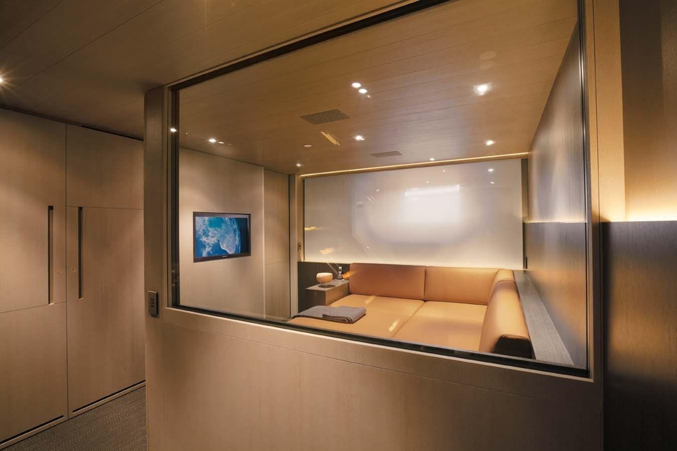 a large room with a tv on the wall aboard ENTERPRISE Yacht for Sale