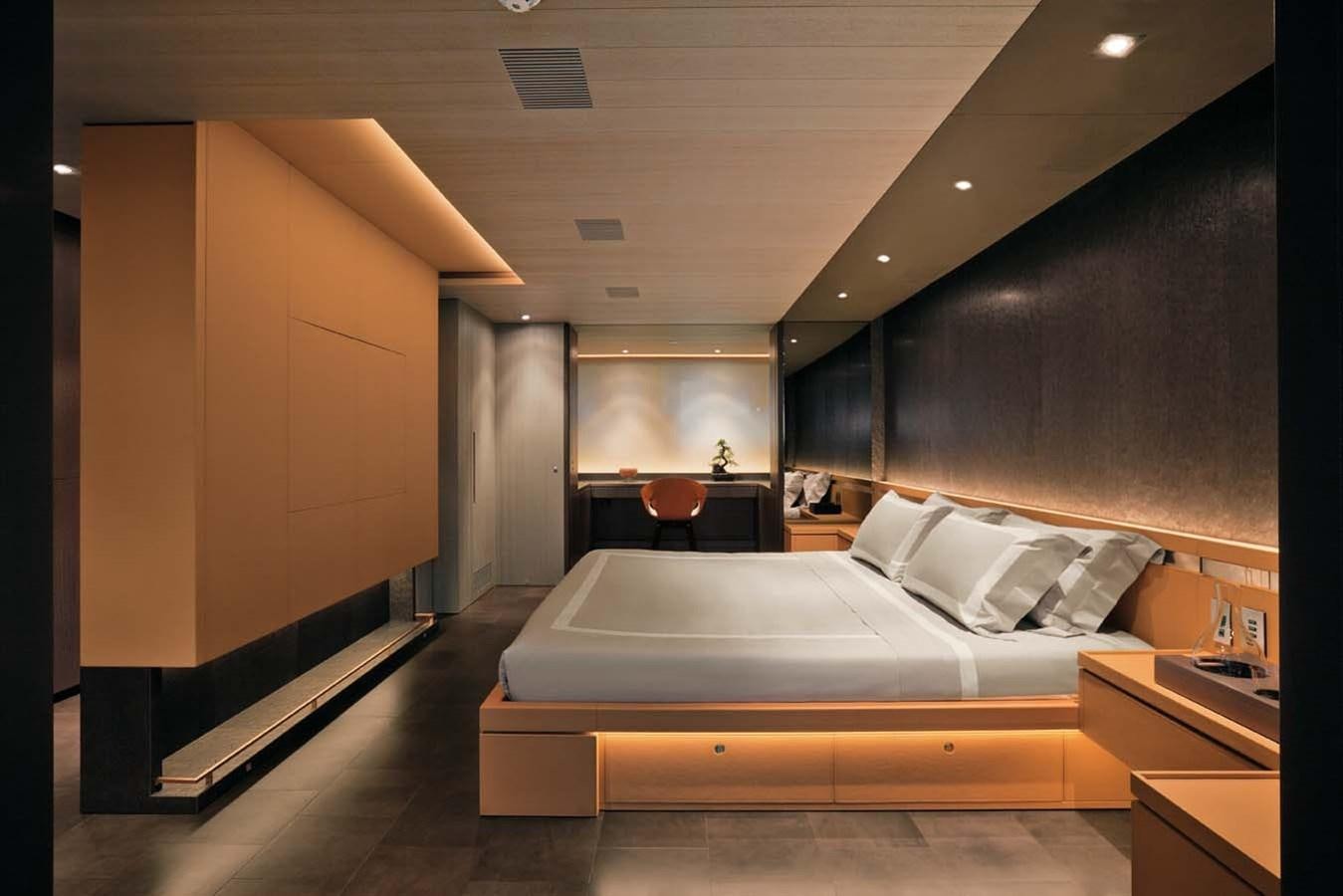 a room with a bed and a desk aboard ENTERPRISE Yacht for Sale