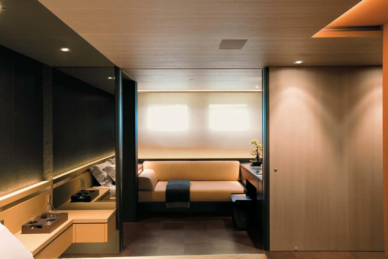 a room with a bed and a desk aboard ENTERPRISE Yacht for Sale