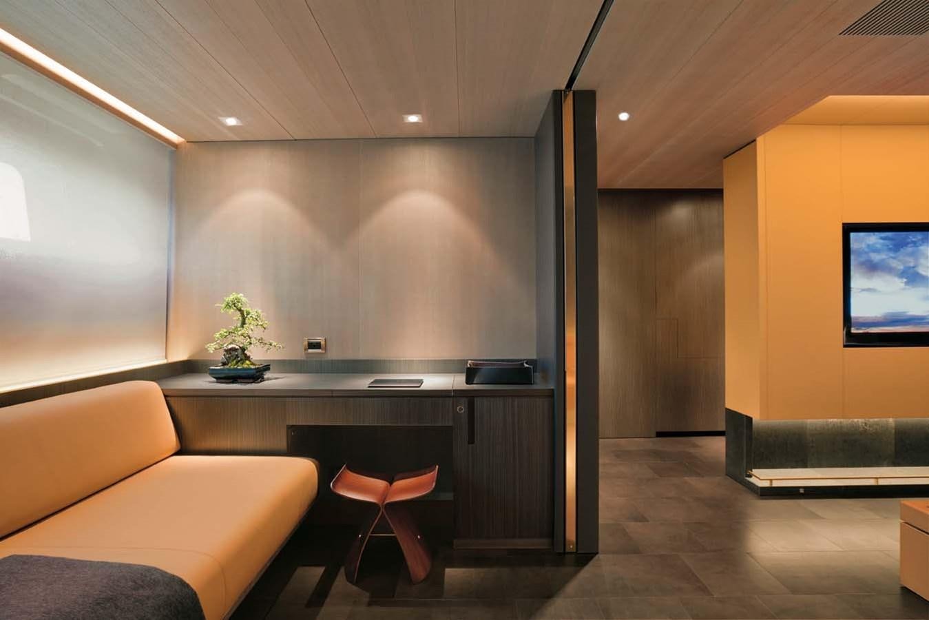 a room with a couch and a desk aboard ENTERPRISE Yacht for Sale