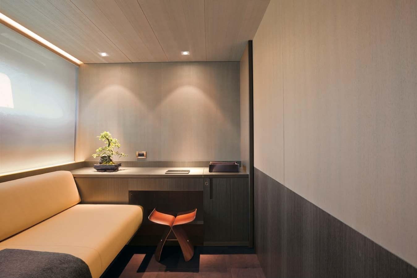 a room with a couch and a desk aboard ENTERPRISE Yacht for Sale