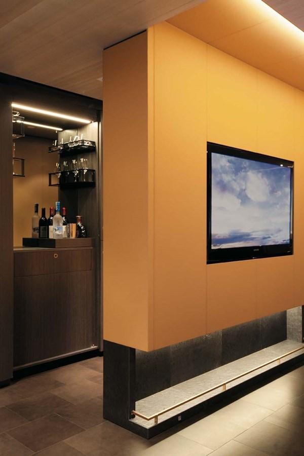 a wine bar with a large screen aboard ENTERPRISE Yacht for Sale