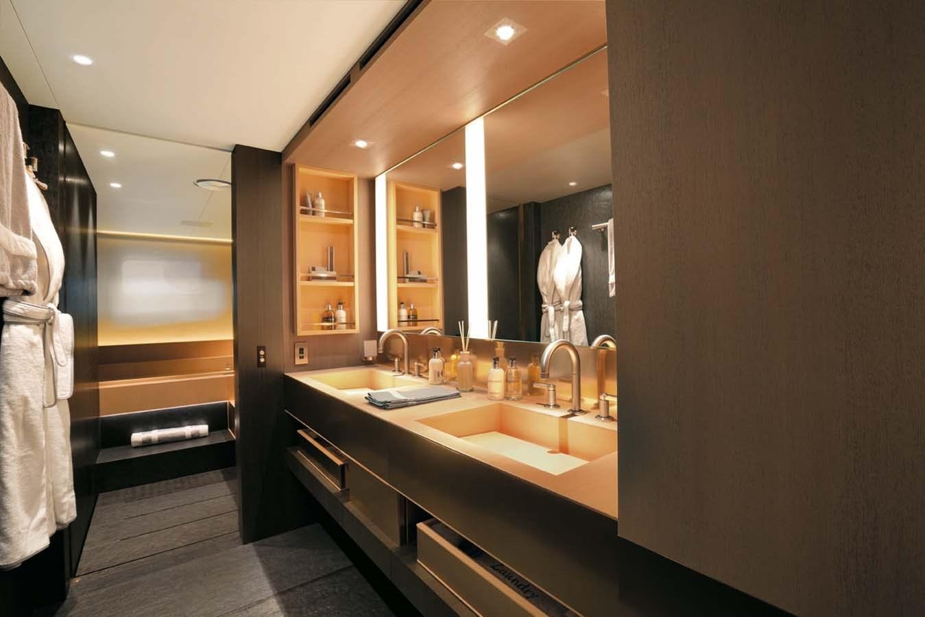 a bathroom with a large mirror aboard ENTERPRISE Yacht for Sale