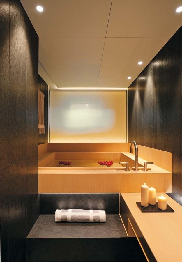 a modern bathroom with a marble countertop aboard ENTERPRISE Yacht for Sale