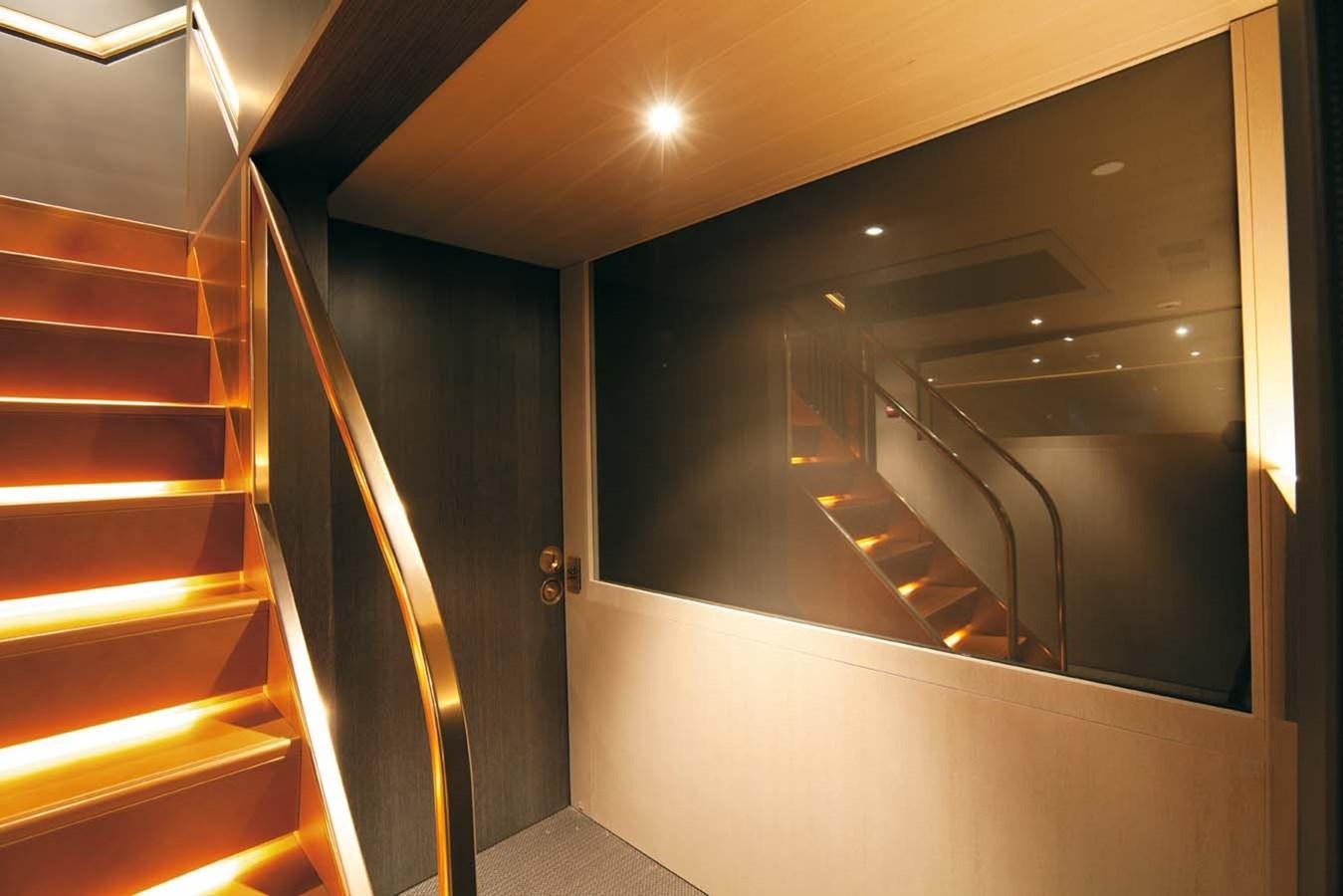 a room with a glass door and a staircase aboard ENTERPRISE Yacht for Sale
