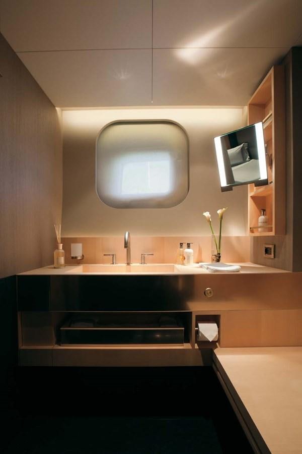 a bathroom with a mirror and a sink aboard ENTERPRISE Yacht for Sale