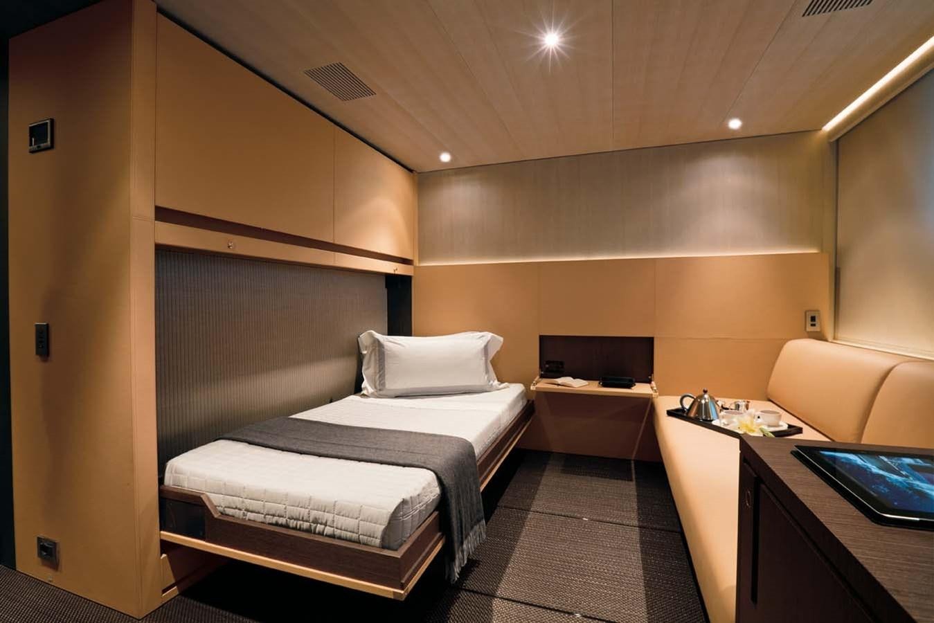 a room with a bed and a desk aboard ENTERPRISE Yacht for Sale
