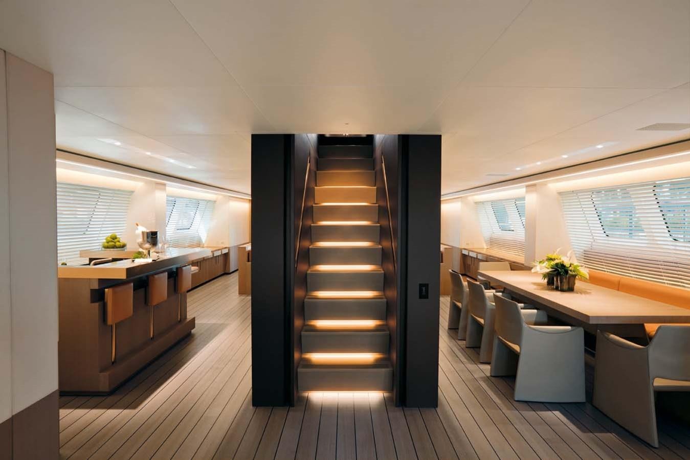 a room with a table and chairs aboard ENTERPRISE Yacht for Sale