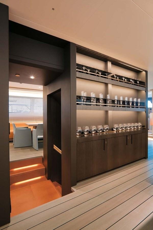 a wine bar with wine glasses aboard ENTERPRISE Yacht for Sale
