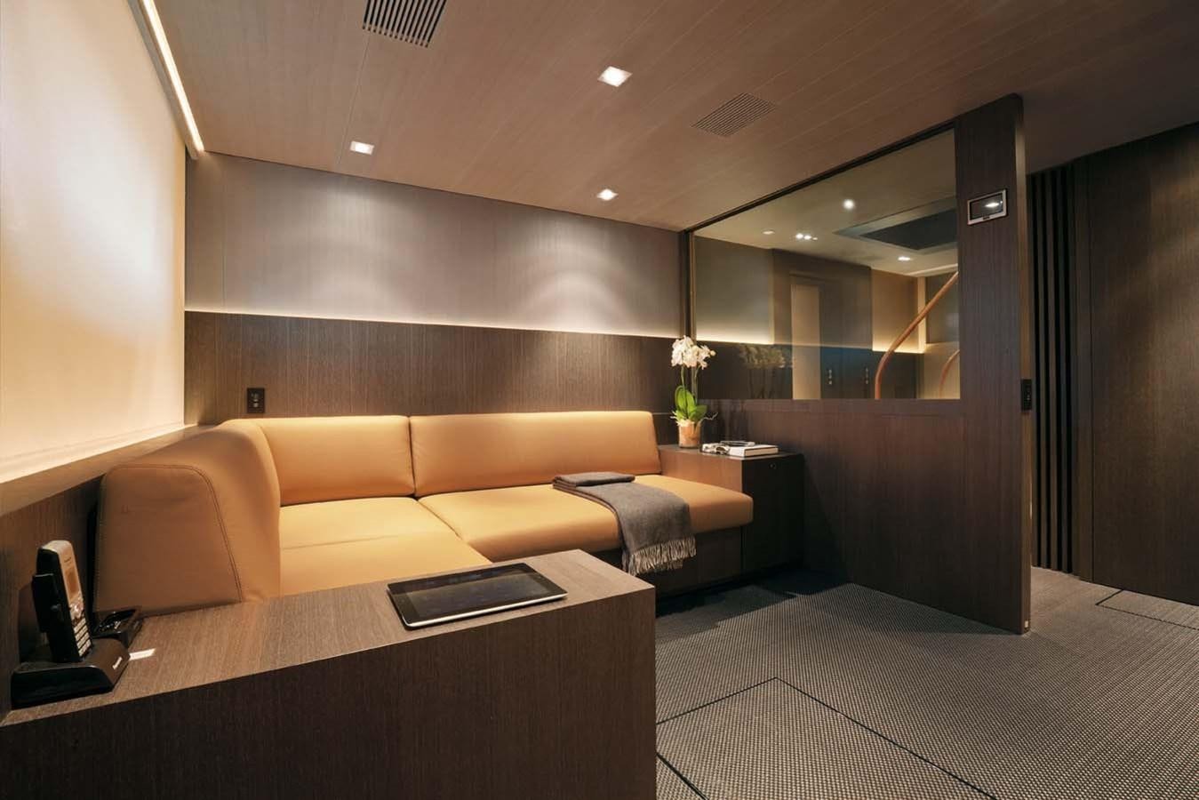 a room with a couch and a table aboard ENTERPRISE Yacht for Sale