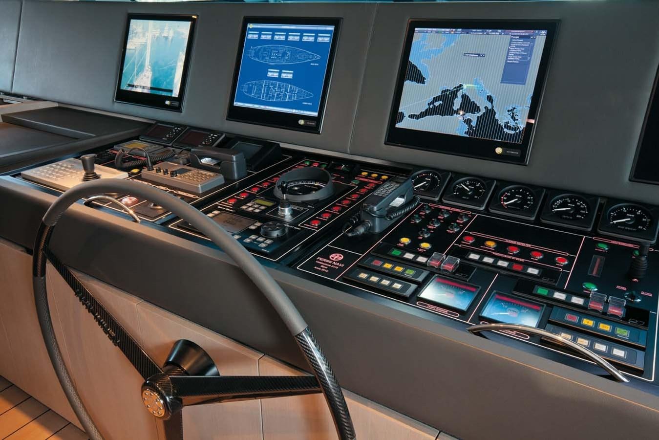 a control panel with monitors and keyboards aboard ENTERPRISE Yacht for Sale