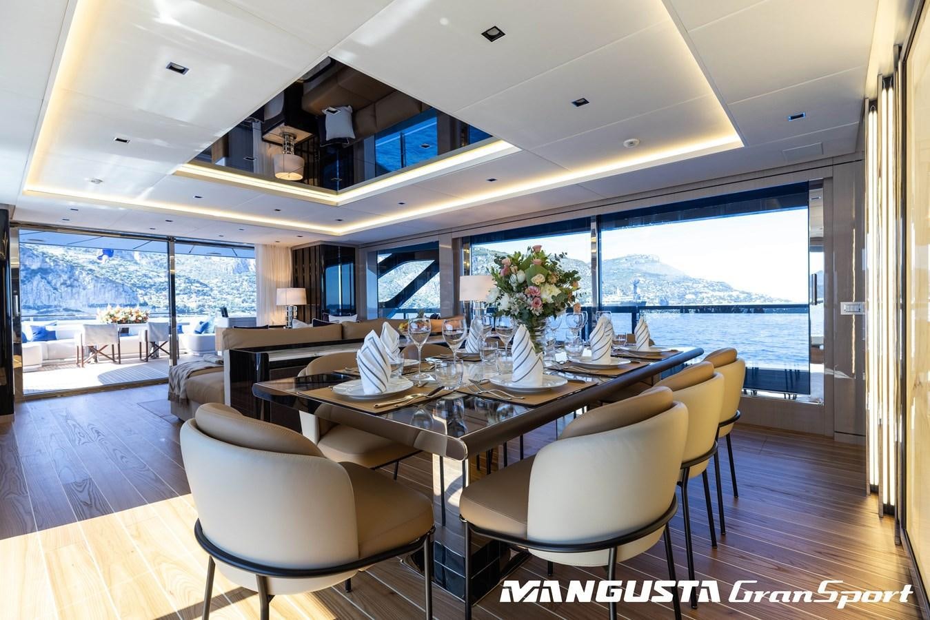 a large dining table in a room aboard C2 Yacht for Charter