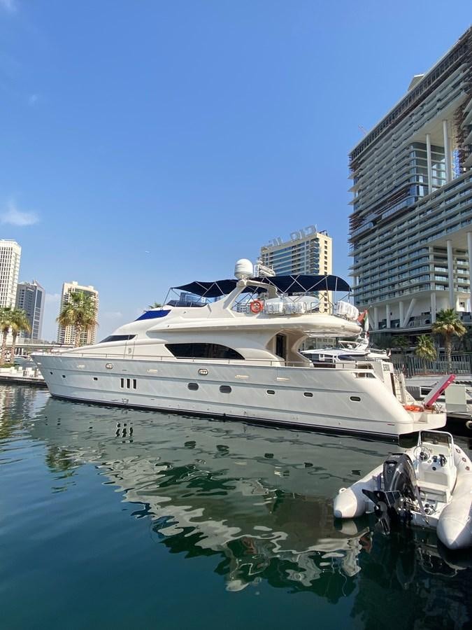 a boat docked at a pier aboard SERDAL Yacht for Sale