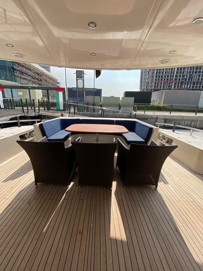 a table and chairs on a deck aboard SERDAL Yacht for Sale