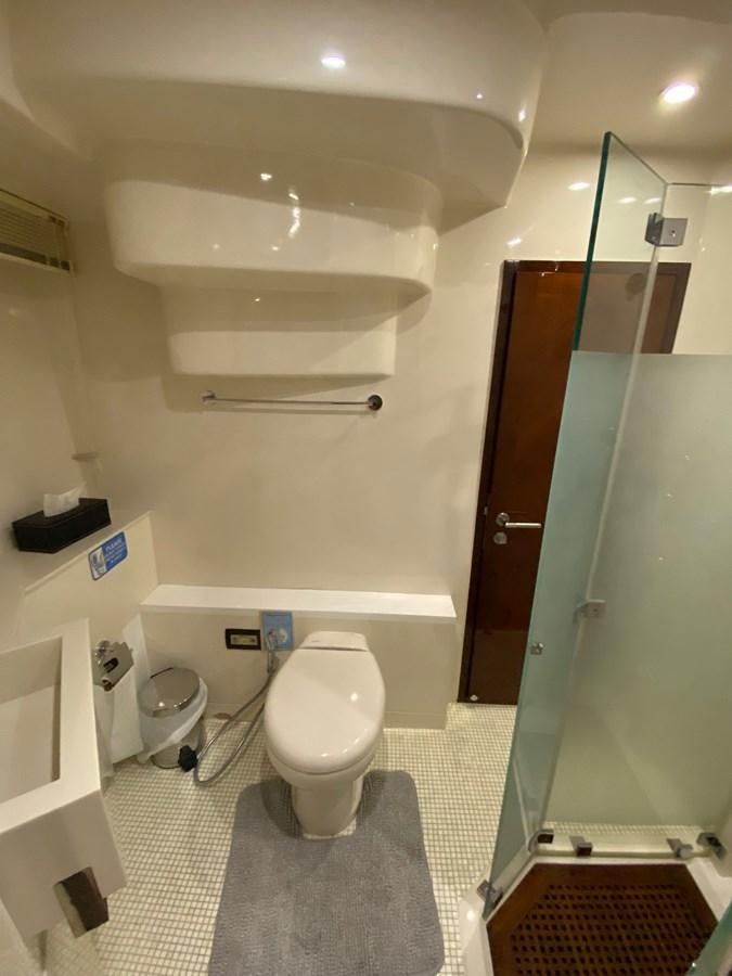 a bathroom with a toilet and a sink aboard SERDAL Yacht for Sale