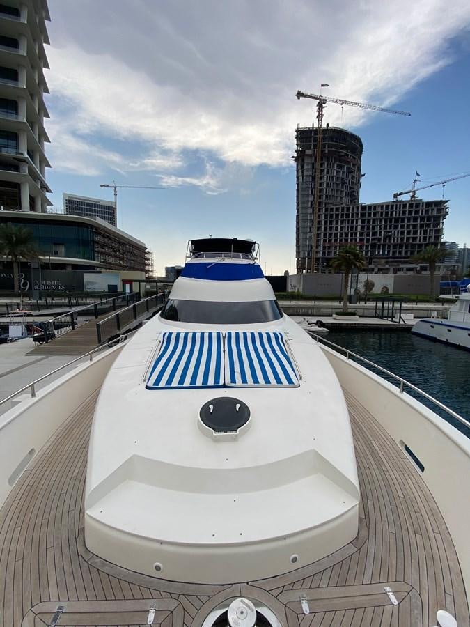 a white and blue boat on a river aboard SERDAL Yacht for Sale
