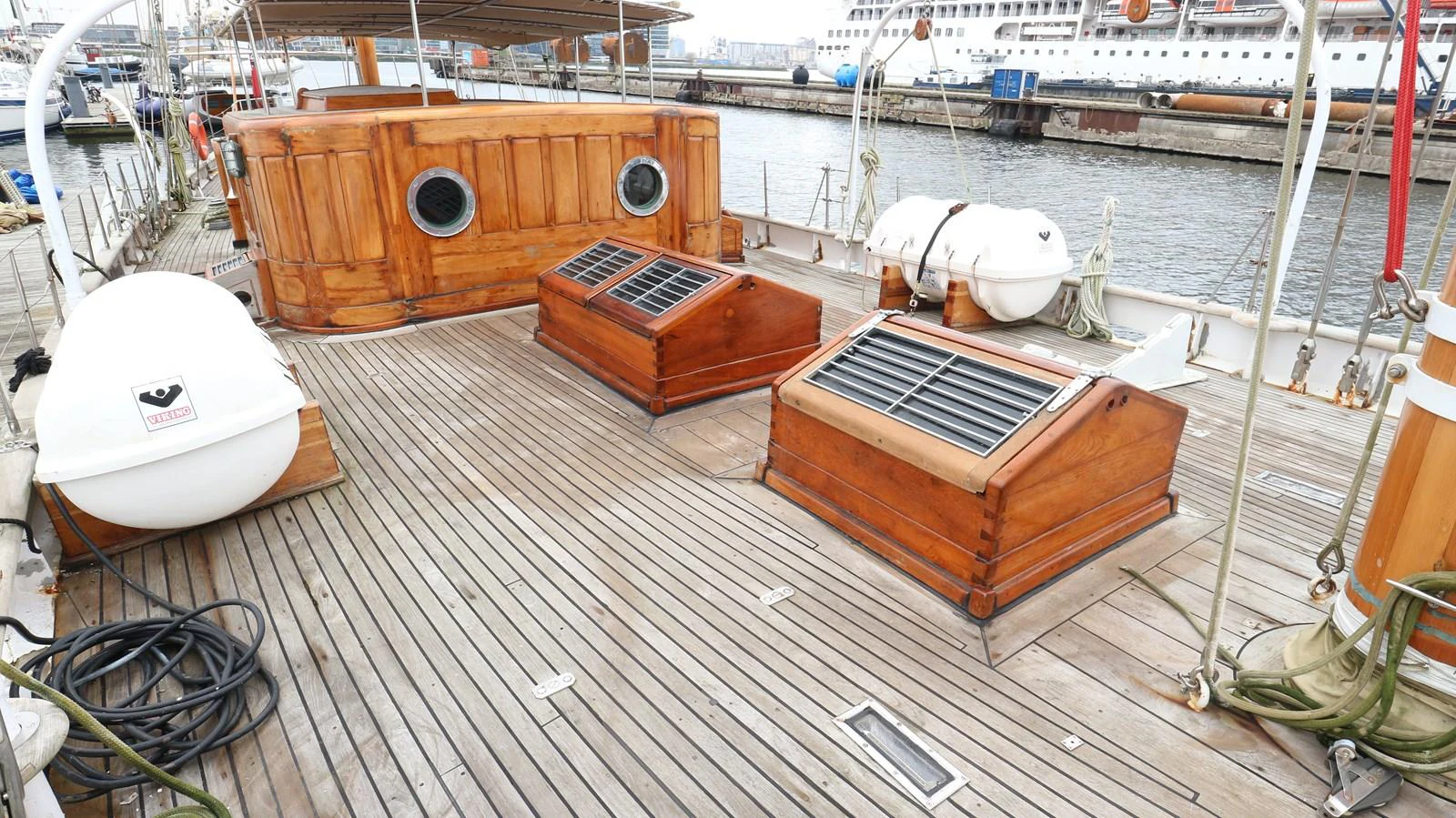 a wooden boat on a dock aboard ARIES Yacht for Sale