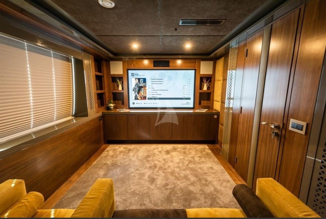 a room with a tv and a couch aboard ARESTEAS Yacht for Sale