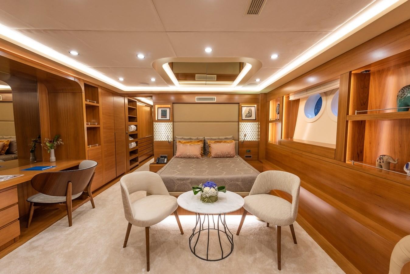 a room with a couch and a table and chairs aboard ARESTEAS Yacht for Sale