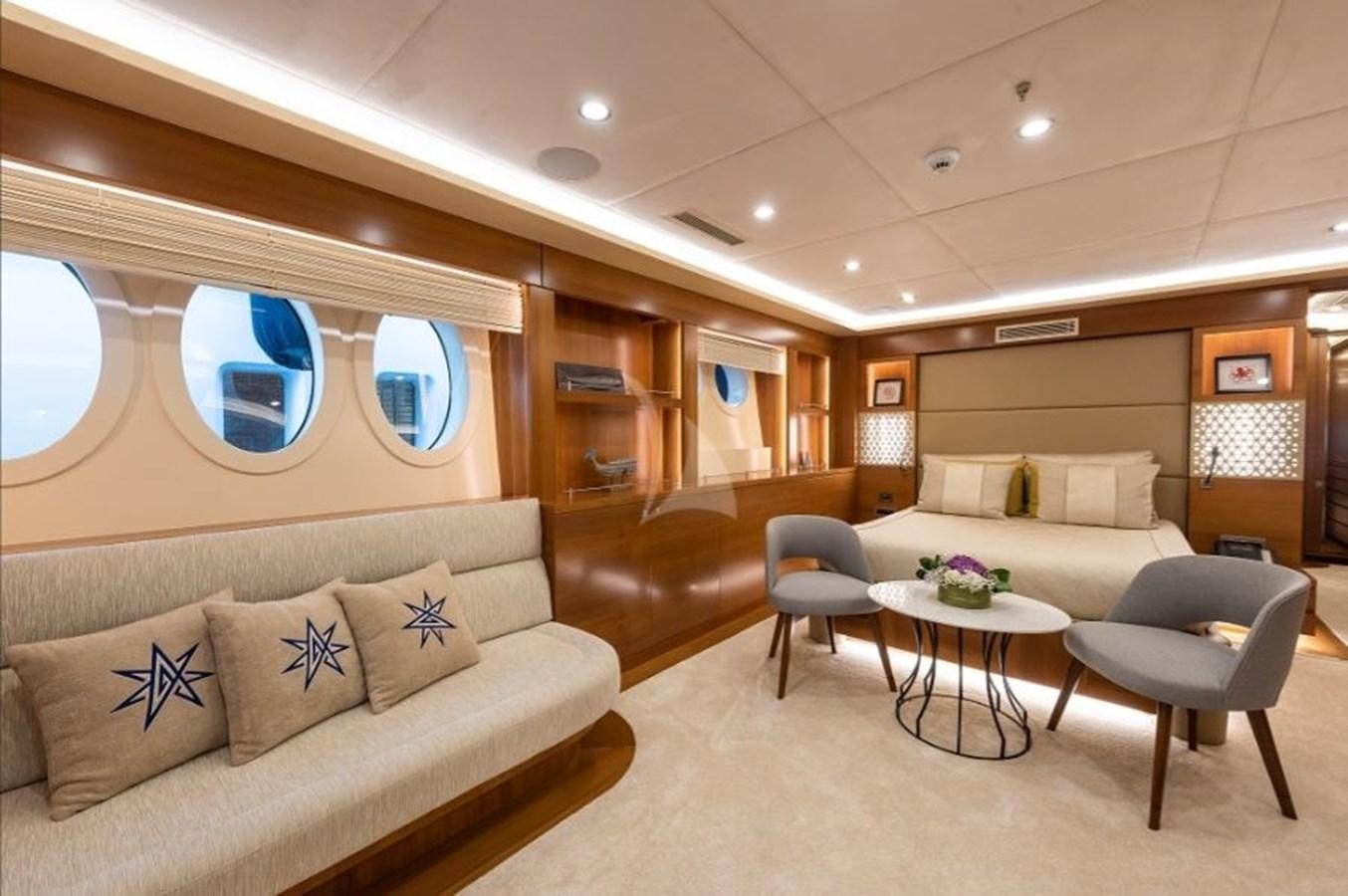 a living room with a couch and a table aboard ARESTEAS Yacht for Sale