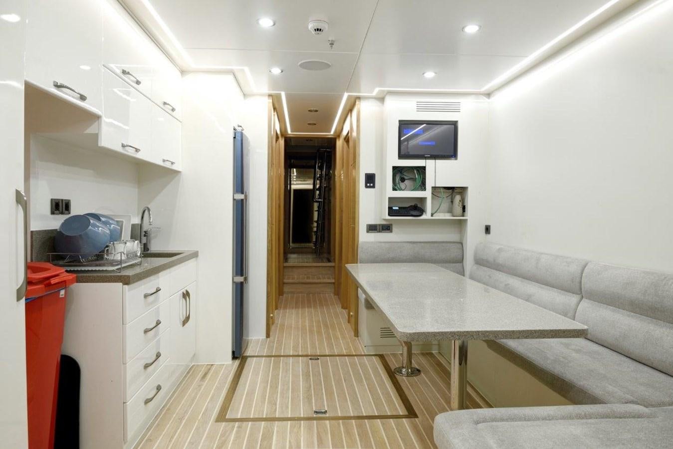 a kitchen and living room aboard ARESTEAS Yacht for Sale