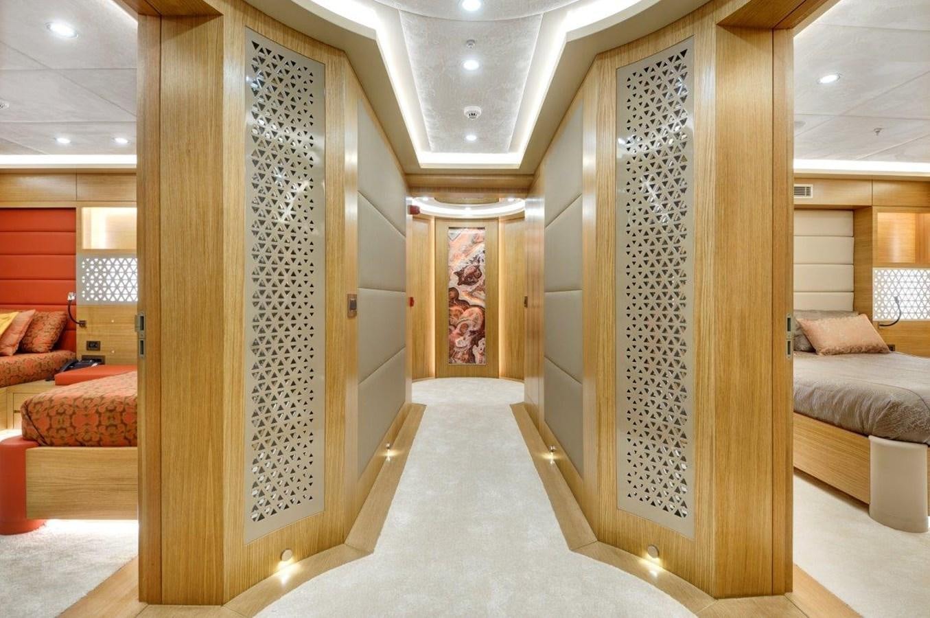 a room with a bed and a couch aboard ARESTEAS Yacht for Sale