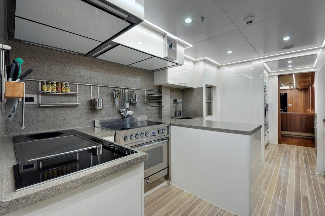 a kitchen with a stove and oven aboard ARESTEAS Yacht for Sale