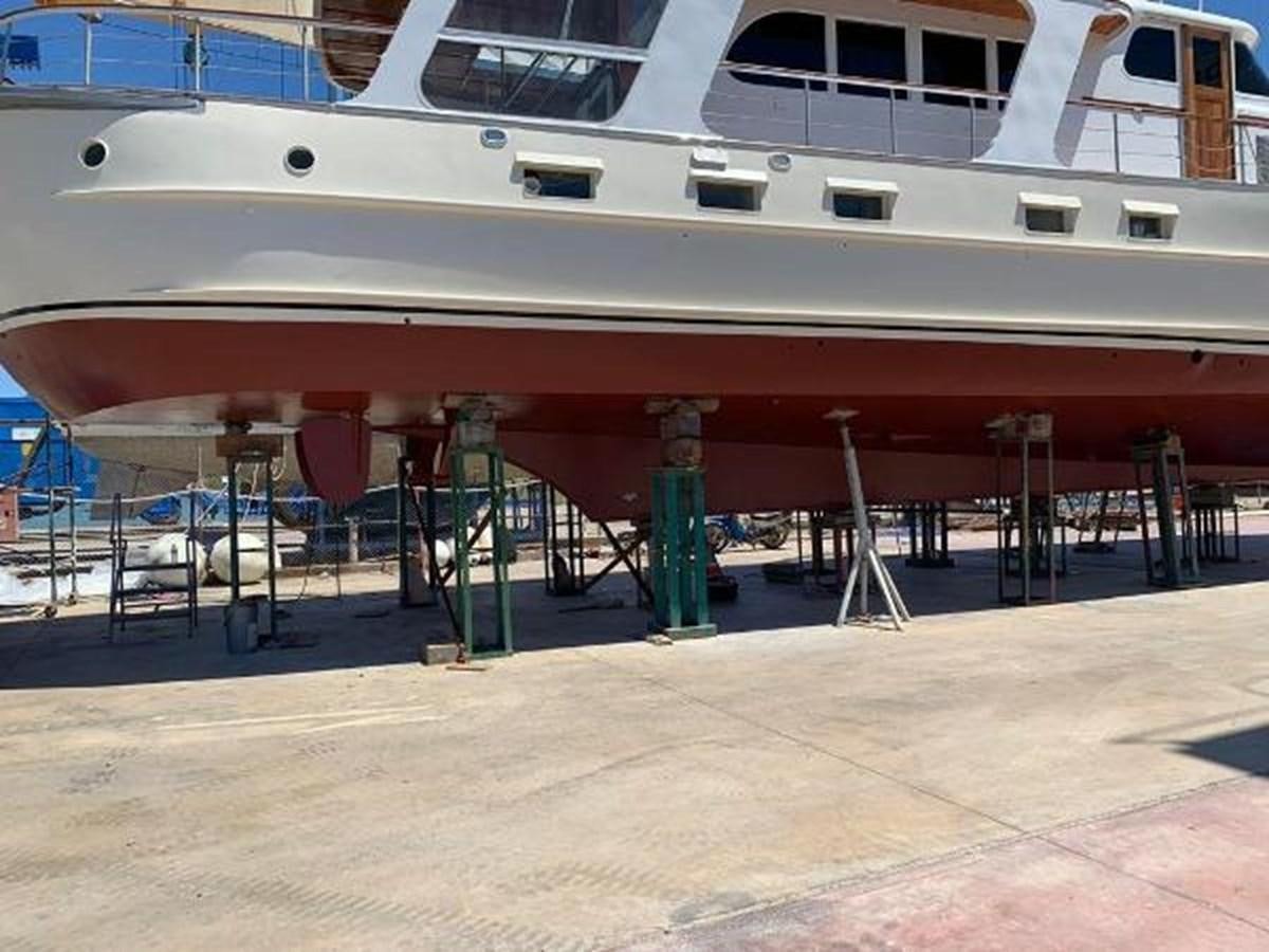 a boat docked at a pier aboard 1960 CUSTOM CRUISER  Yacht for Sale