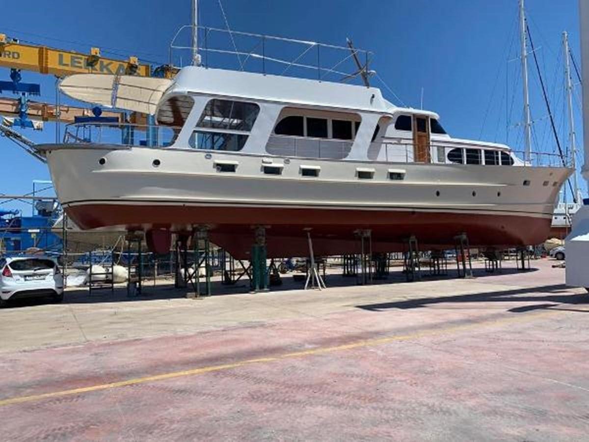 a large white boat docked aboard 1960 CUSTOM CRUISER  Yacht for Sale