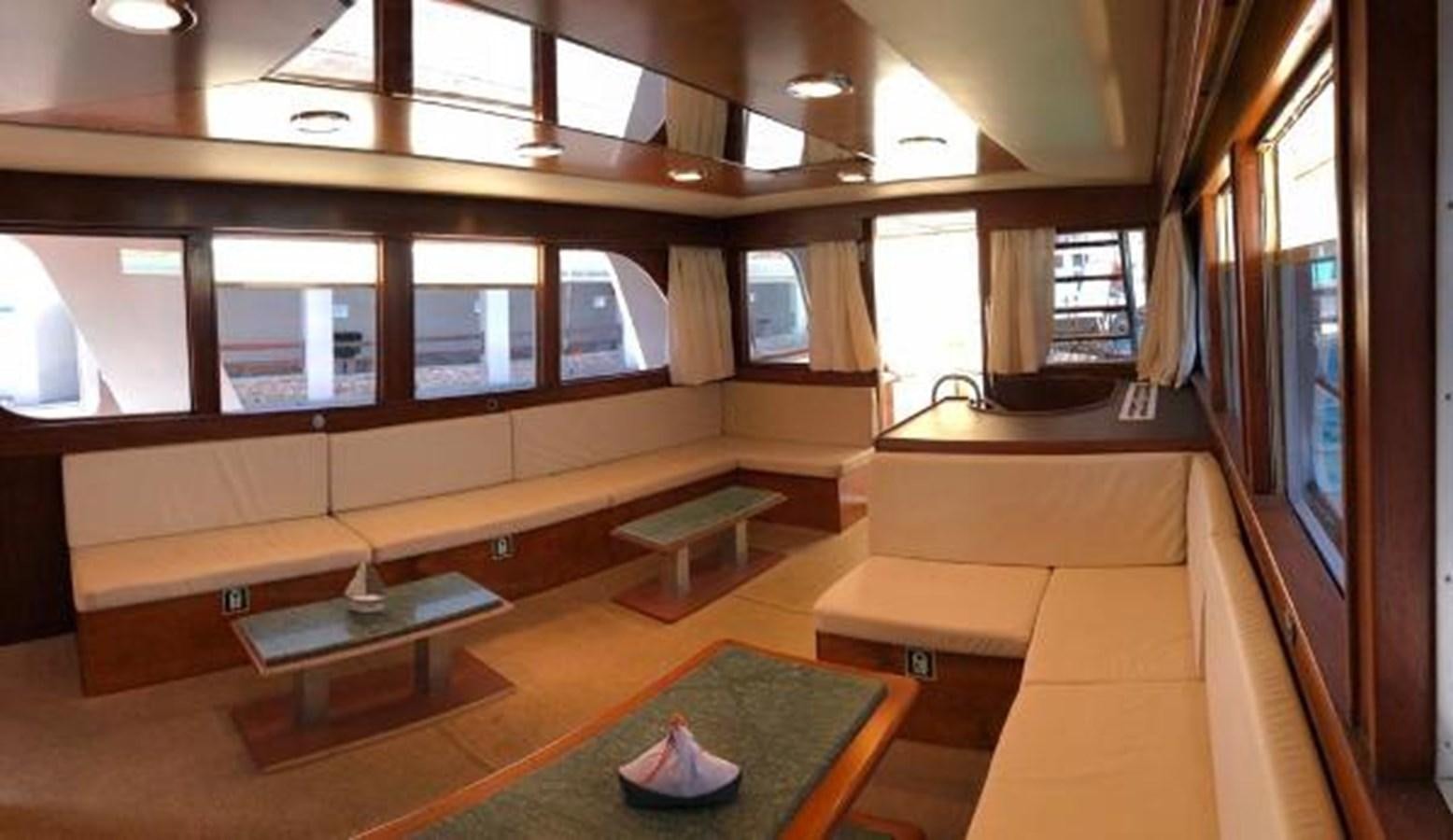 a room with a table and chairs aboard 1960 CUSTOM CRUISER  Yacht for Sale