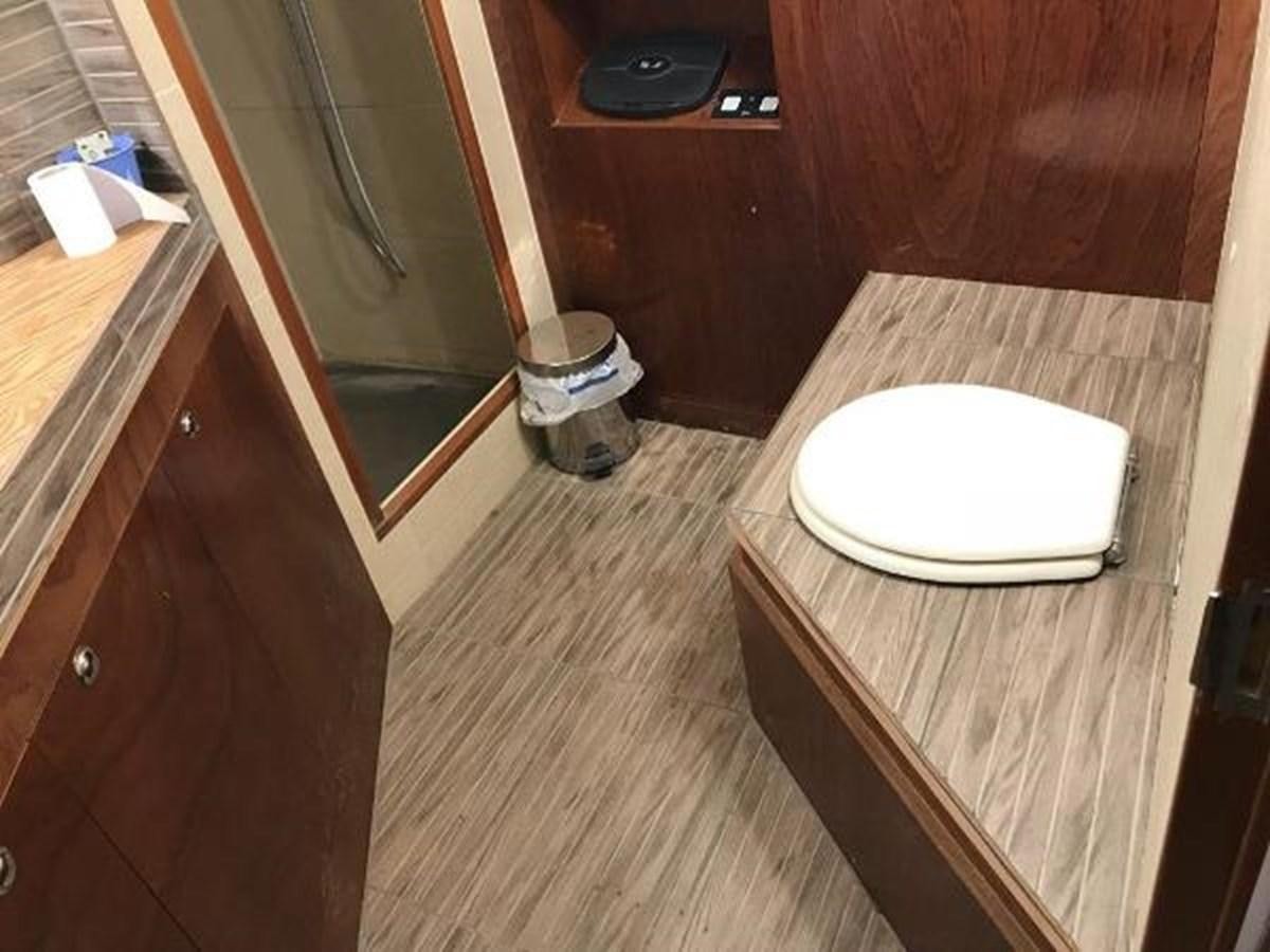 a bathroom with a tub aboard 1960 CUSTOM CRUISER  Yacht for Sale