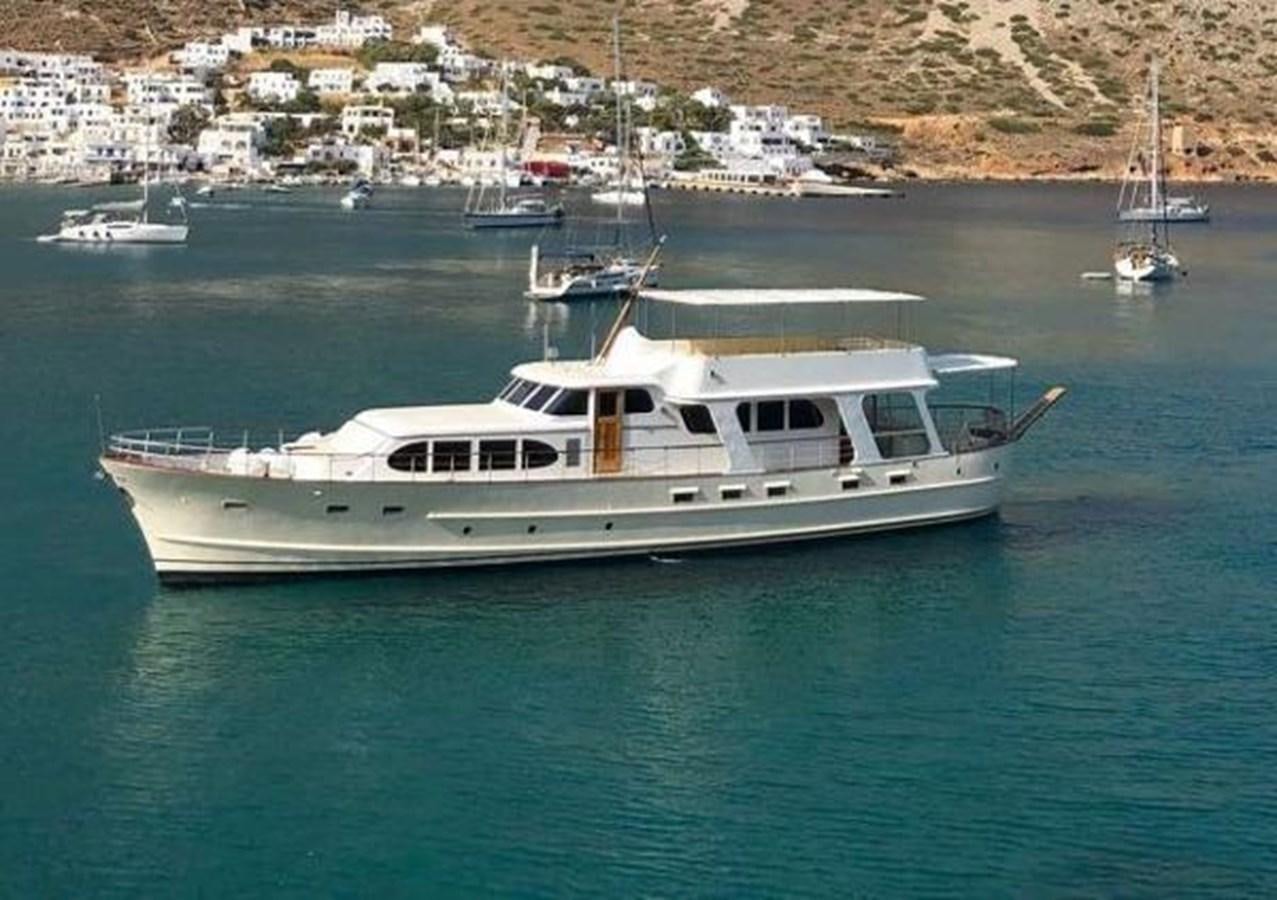 a white boat in the water aboard 1960 CUSTOM CRUISER  Yacht for Sale