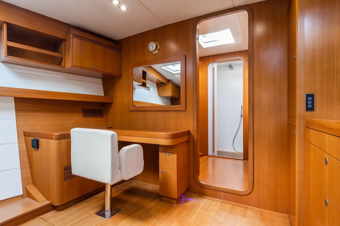 a bathroom with a toilet and a mirror aboard SHADOW Yacht for Sale