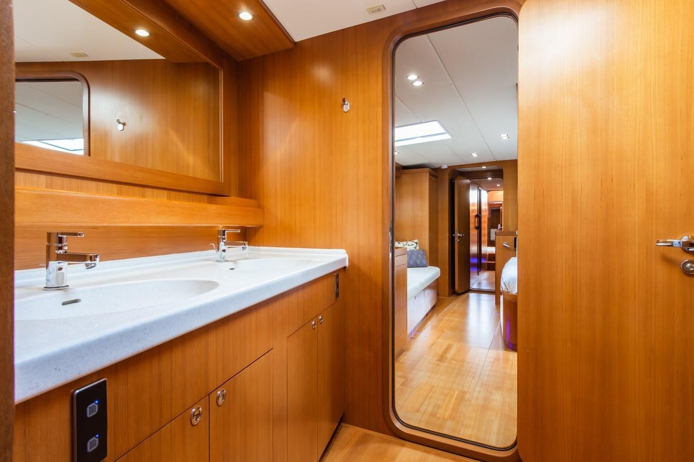 a bathroom with a sink and a mirror aboard SHADOW Yacht for Sale