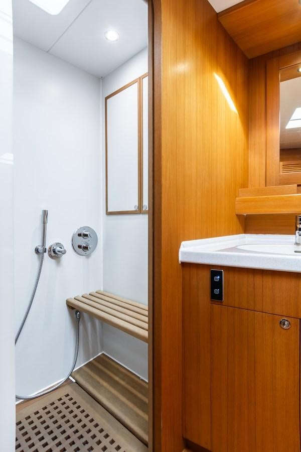 a bathroom with a shower unit aboard SHADOW Yacht for Sale