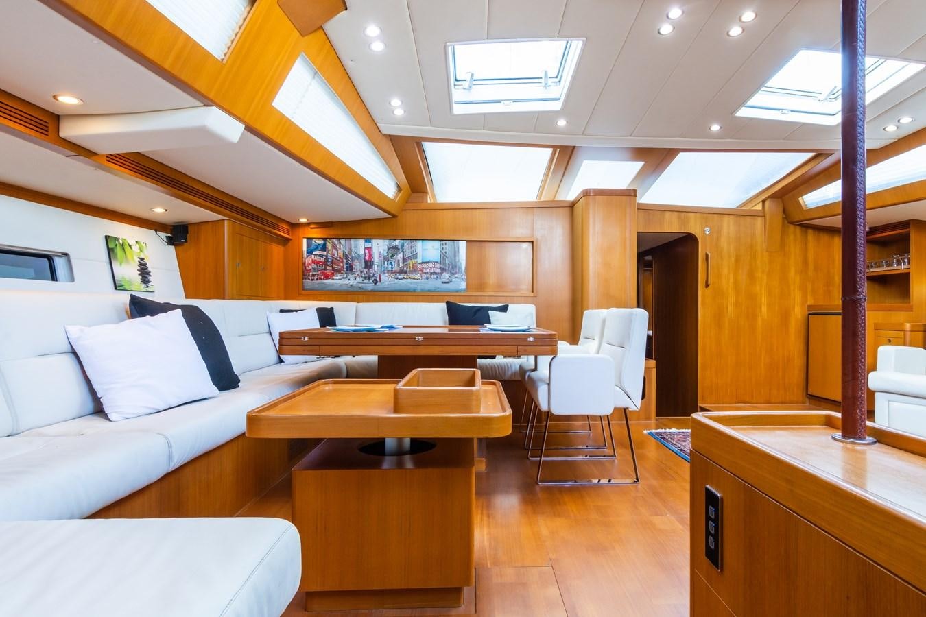 a room with a couch and a table aboard SHADOW Yacht for Sale
