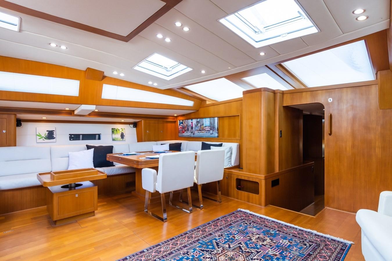 a room with a table and chairs aboard SHADOW Yacht for Sale