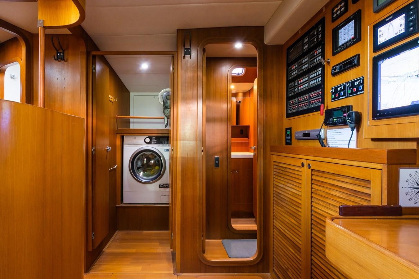 a room with a washer and dryer aboard SHADOW Yacht for Sale